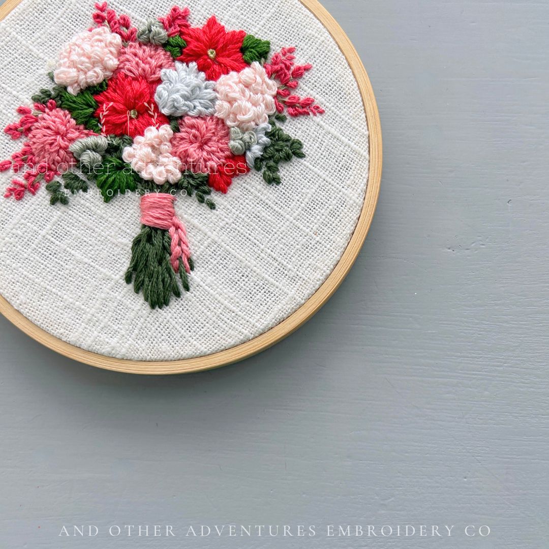 Radiant Red Poinsettia holiday bouquet hoop art hand embroidered by And Other Adventures Embroidery Co