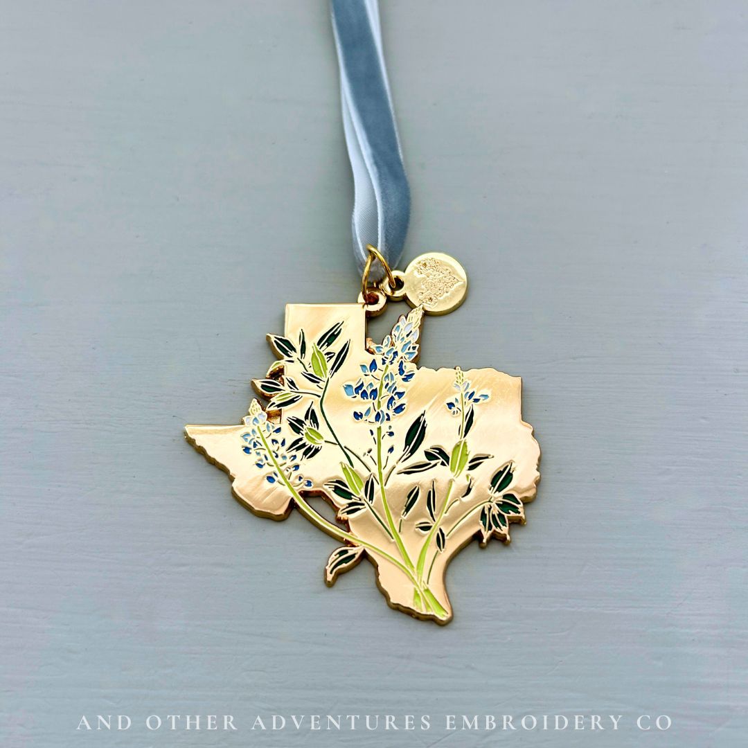 Gold Texas Bluebonnet Ornament with blue ribbon