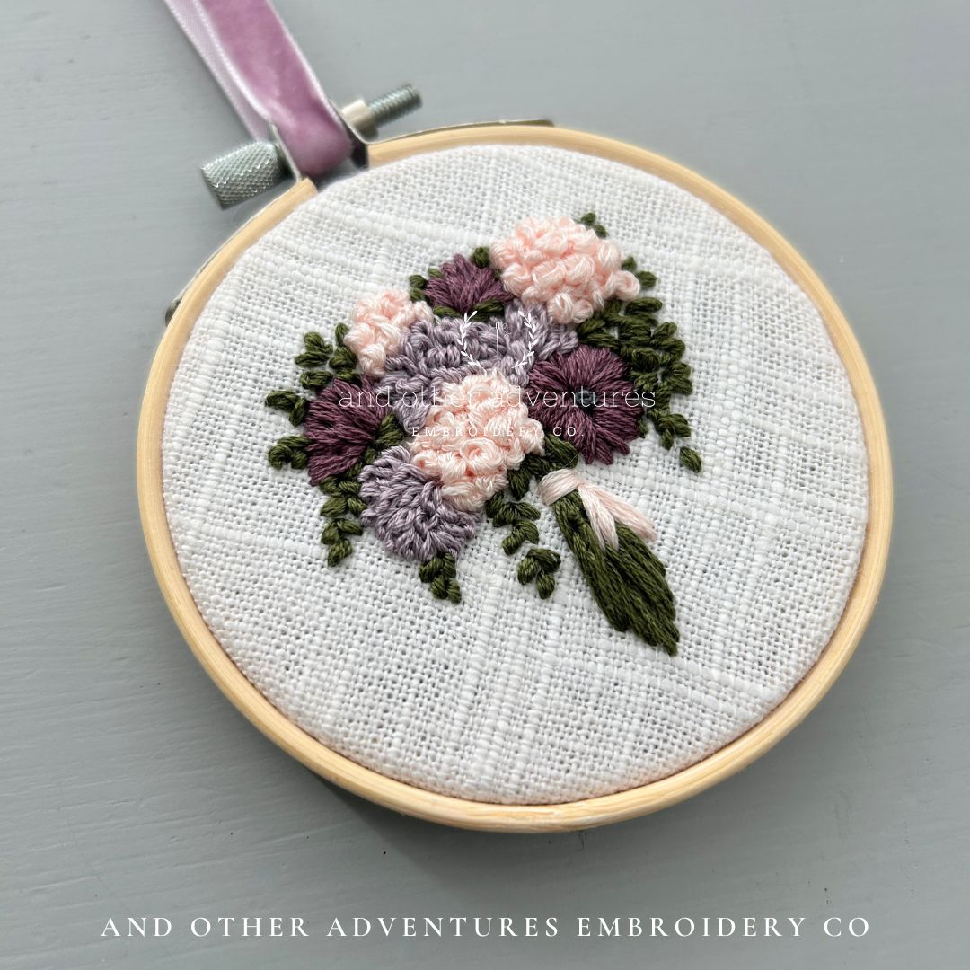 Moody purple and blush pink flowers hand embroidered by And Other Adventures Embroidery Co