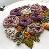 Hand Embroidered Fall Florals in shades of purple, gold, and olive green by And Other Adventures Embroidery Co
