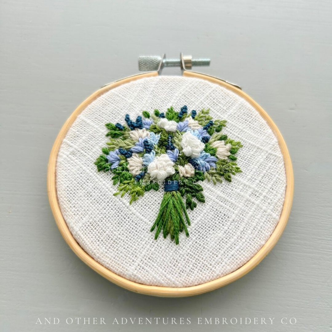 Enchanting blue white and green floral bouquet hand embroidered by And Other Adventures Embroidery Co