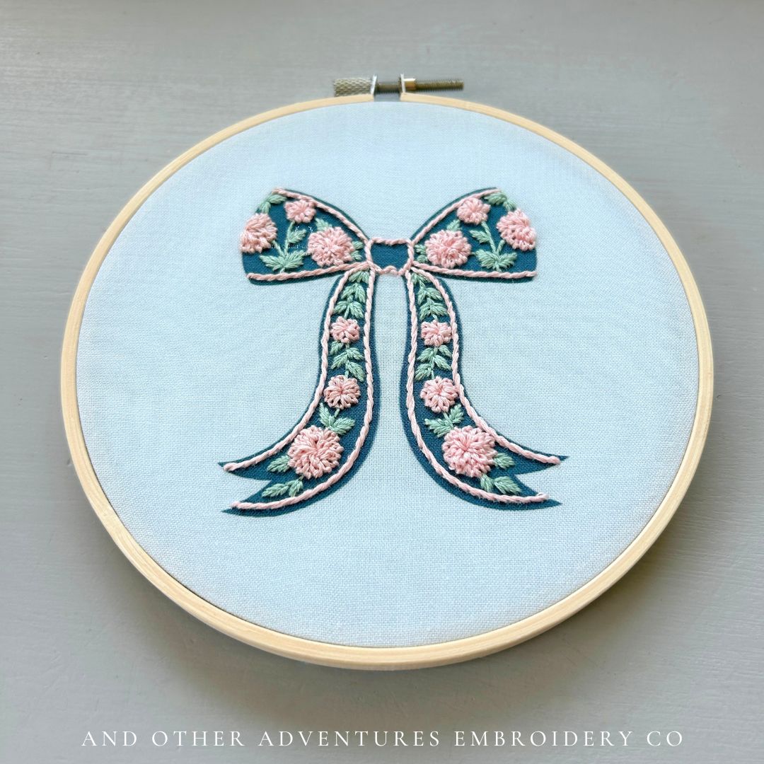Hand Stitched Blush Florals on Navy Bow hand embroidery kit by And Other Adventures Embroidery Co