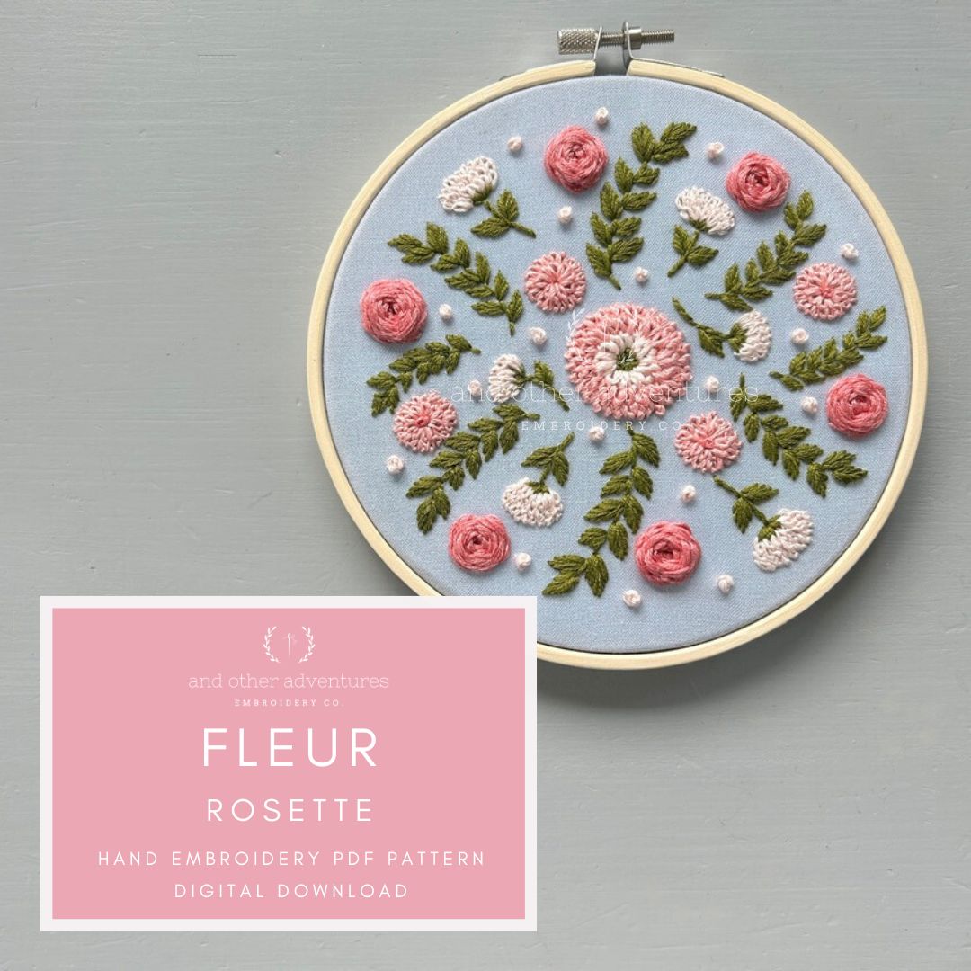 Embroidery hoop with floral design on a gray background, featuring a digital download pdf file for 'Fleur Rosette' pattern.