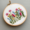 Happy Day Meadow hand embroidery kit featuring bright colorful flowers by And Other Adventures Embroidery Co