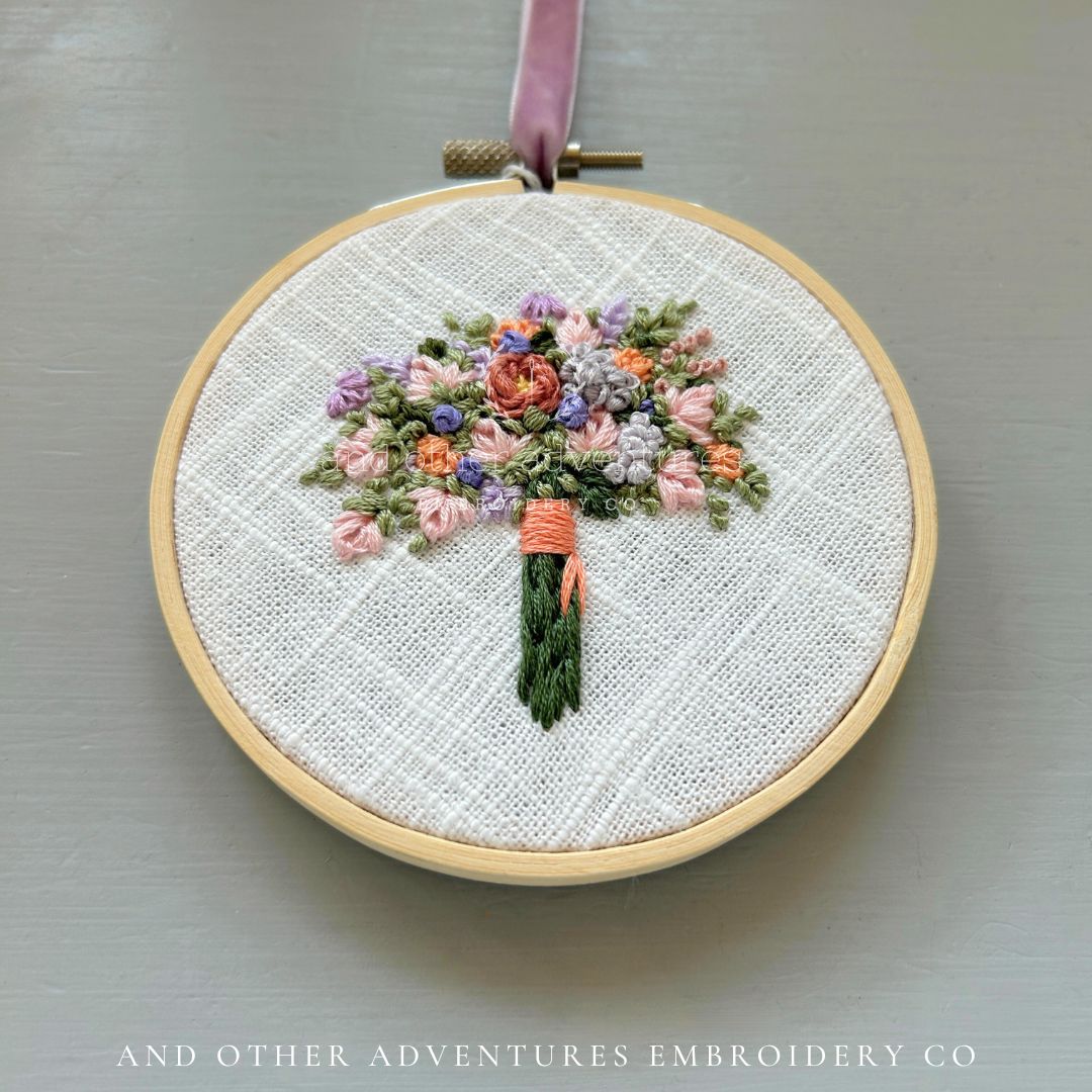Hand Embroidered Flower Bouquet filled with delicate orange, purple and pink florals - art by And Other Adventures Embroidery Co