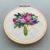 Colorful fuchsia and navy blue flower bouquet hand stitched by And Other Adventures Embroidery Co