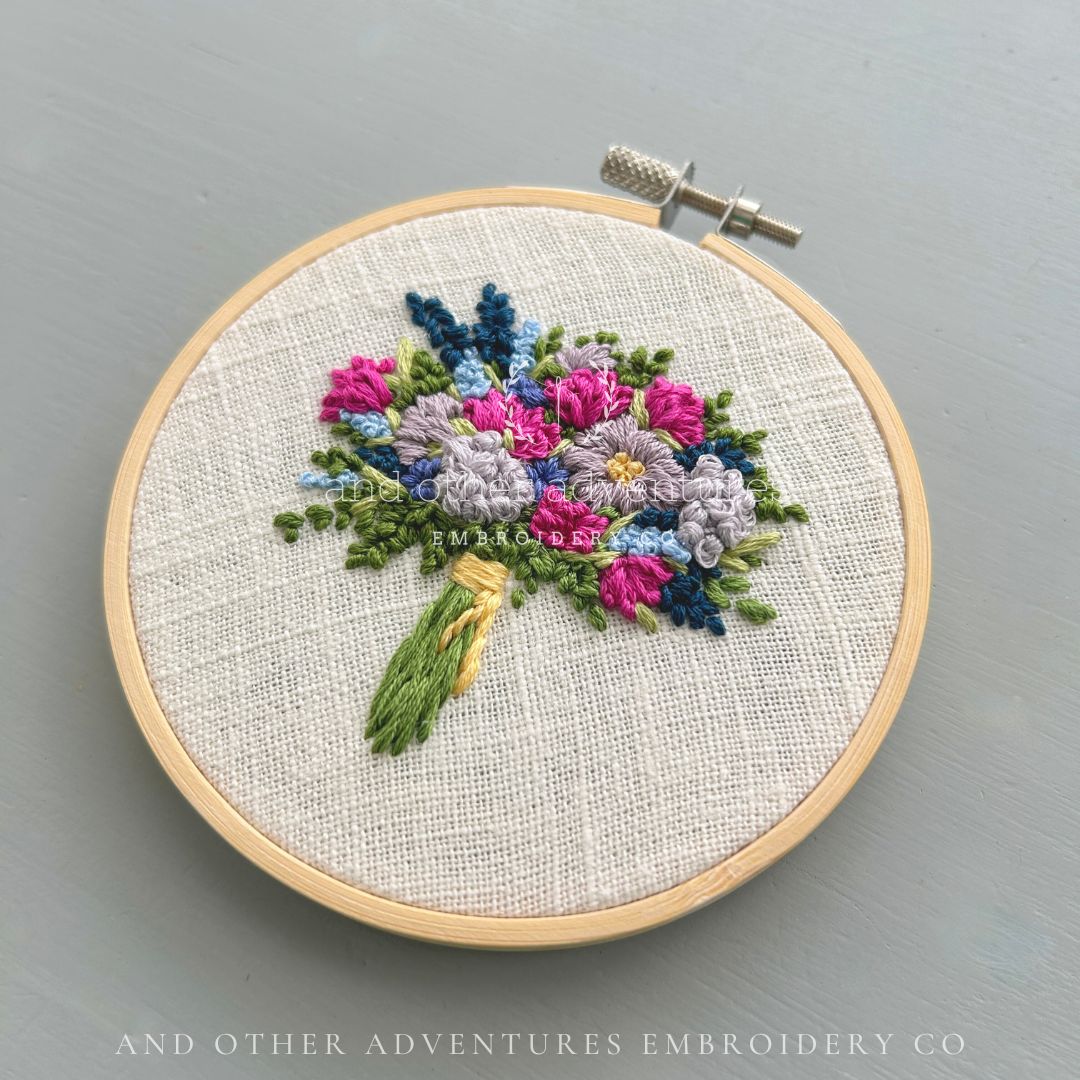 Whimsical bright flower bouquet hoop art hand embroidered by And Other Adventures Embroidery Co