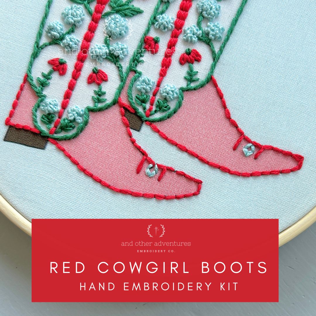 Hand embroidery kit with red cowgirl boots design on a light blue background by And Other Adventures Embroidery Co