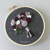 Rich purple and green embroidered bouquet hoop art by And Other Adventures Embroidery Co