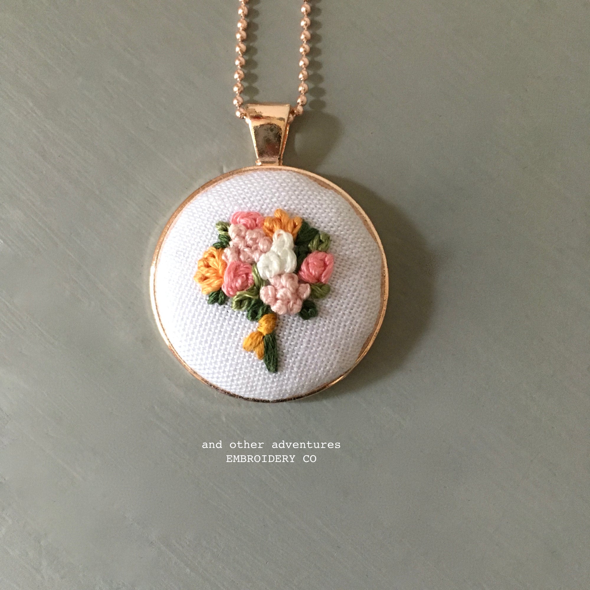 Hand stitched floral bouquet necklace by And Other Adventures Embroidery Co