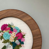Beautiful, bright, and bold hand embroidered floral bouquet art by And Other Adventures Embroidery Co