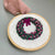 Hand Embroidered Wreath Ornament in shades of pink and green by And Other Adventures Embroidery Co