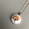 Hand embroidered floral bouquet necklace by And Other Adventures