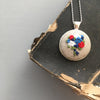 red, white, and blue necklace